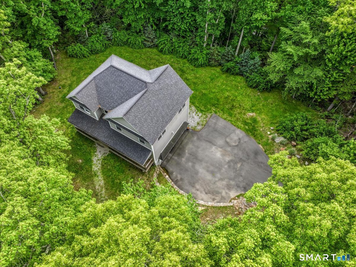 127 Putnam Park Road Bethel, CT 06801 - Photo 31 of 35 a view of an house with backyard space and garden
