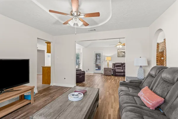 a living room with furniture and a flat screen tv