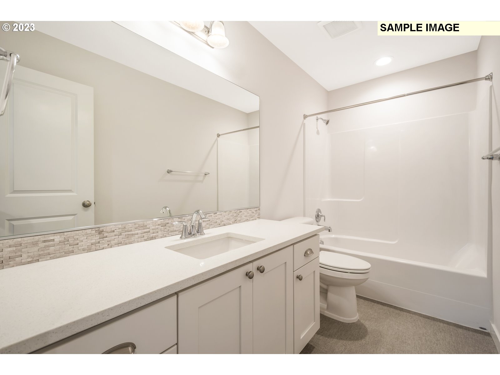 217 South 87th, Unit 46 Ridgefield, WA 98642 - Photo 19 of 24 a bathroom with a granite countertop sink toilet a large mirror a shower and vanity