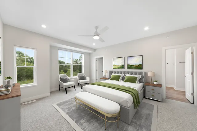 a bedroom with a bed and glass window