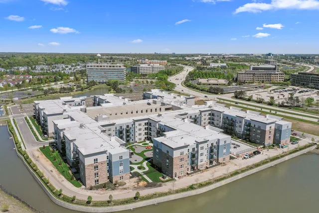 a bedroom with a large bed and a large window