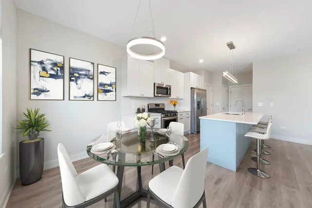 a dining room with furniture and window