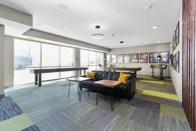 a room with furniture and a pool table