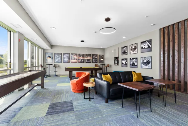 a living room with furniture and flat screen tv