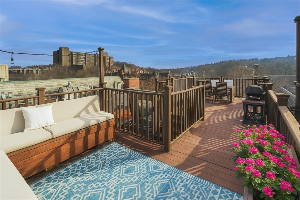 1778 Beacon Street, Unit 302 Brookline, MA 02445 - Photo 15 of 18 a balcony with furniture and city view