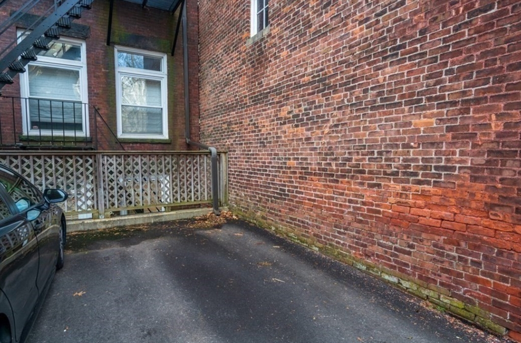 1778 Beacon Street, Unit 302 Brookline, MA 02445 - Photo 18 of 18 a view of a brick house with an empty space
