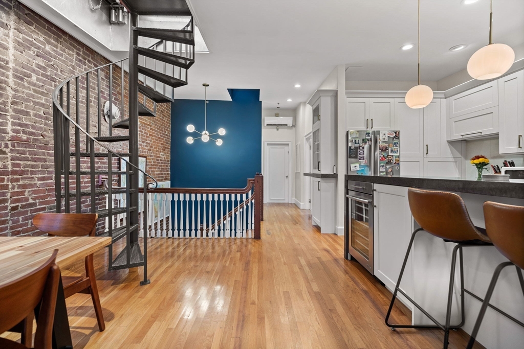 1778 Beacon Street, Unit 302 Brookline, MA 02445 - Photo 8 of 18 a view of a kitchen with furniture and wooden floor
