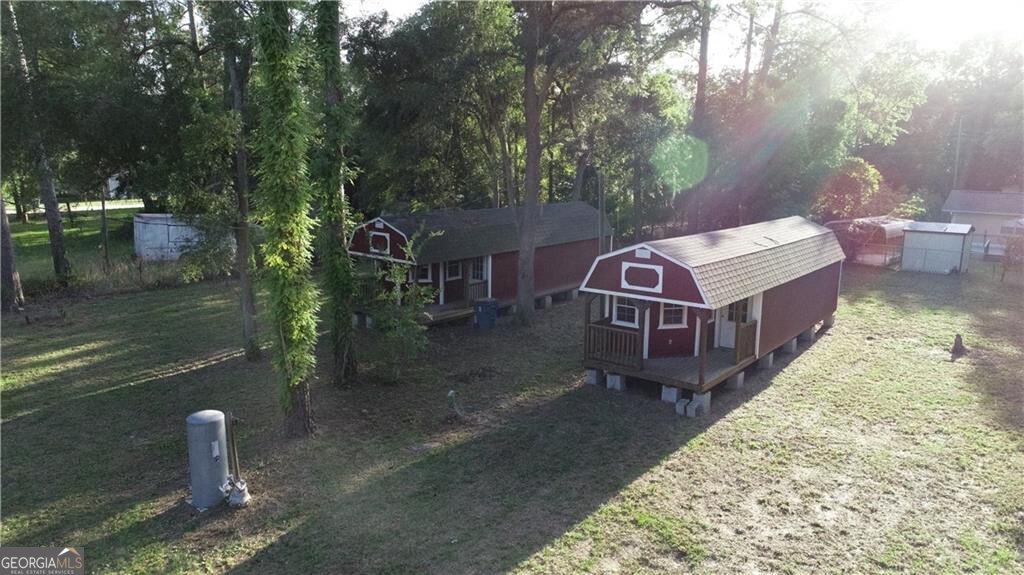 41 Middle Road Hortense, GA 31543 - Photo 18 of 22 a view of a house with a yard balcony and lake view