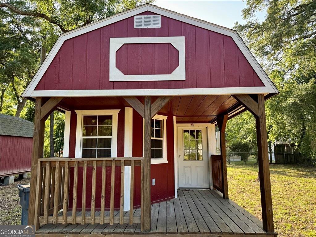 41 Middle Road Hortense, GA 31543 - Photo 4 of 22 a view of a house with porch and wooden floor