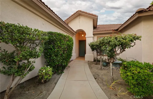 a backyard of a house with a garden