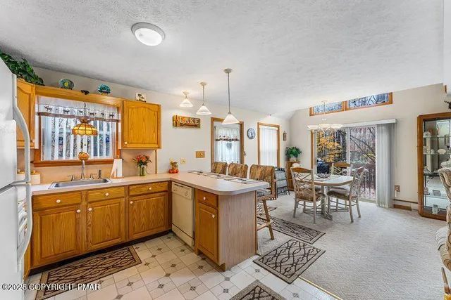 a view of a kitchen area with furniture and window