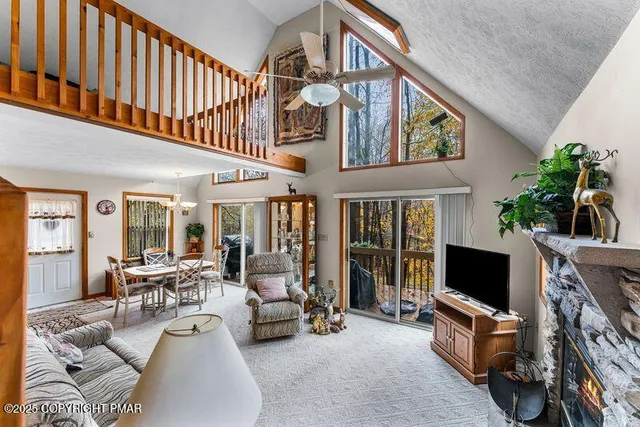 a living room with furniture fireplace and flat screen tv