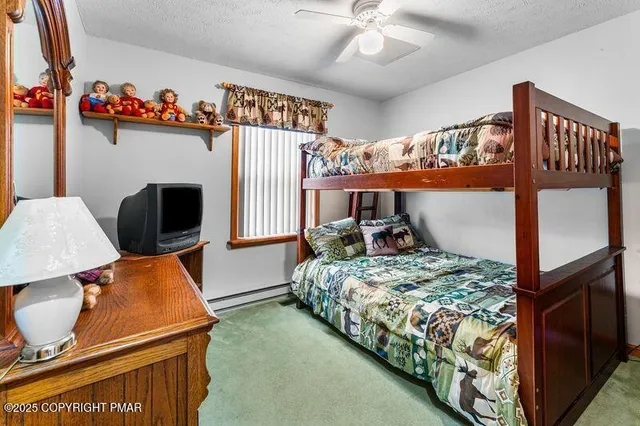 a bedroom with bed and windows