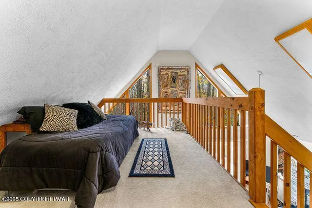 a bed room with a bed and a chair