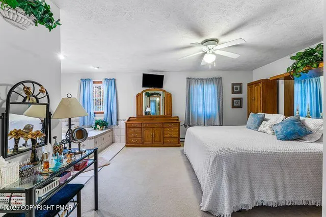 a bed room with a bed and a television