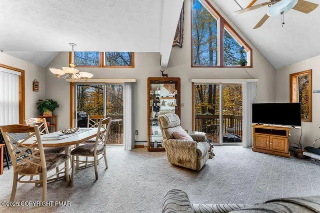 a living room with furniture a rug and a flat screen tv