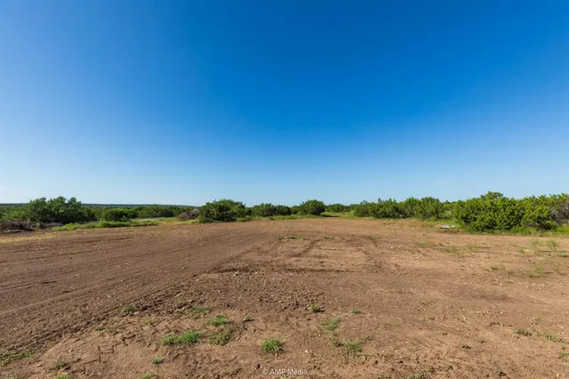 a view of a lake with a yard