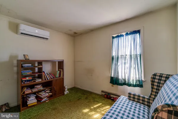 a view of room with window and closet