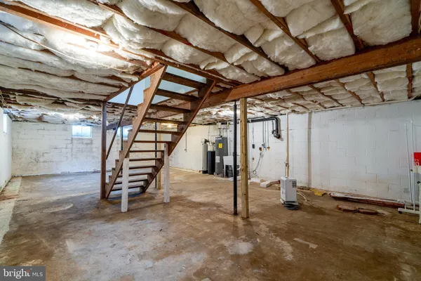 a view of an empty room with stairs