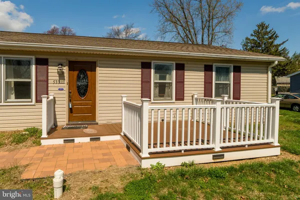 a front view of a house with a porch