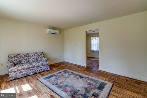 a living room with furniture and a rug
