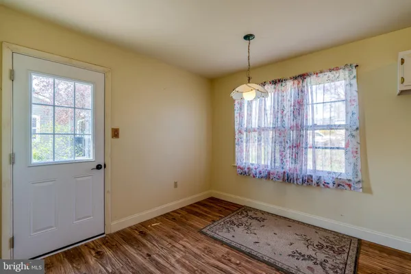 a room that has a window and wooden floor