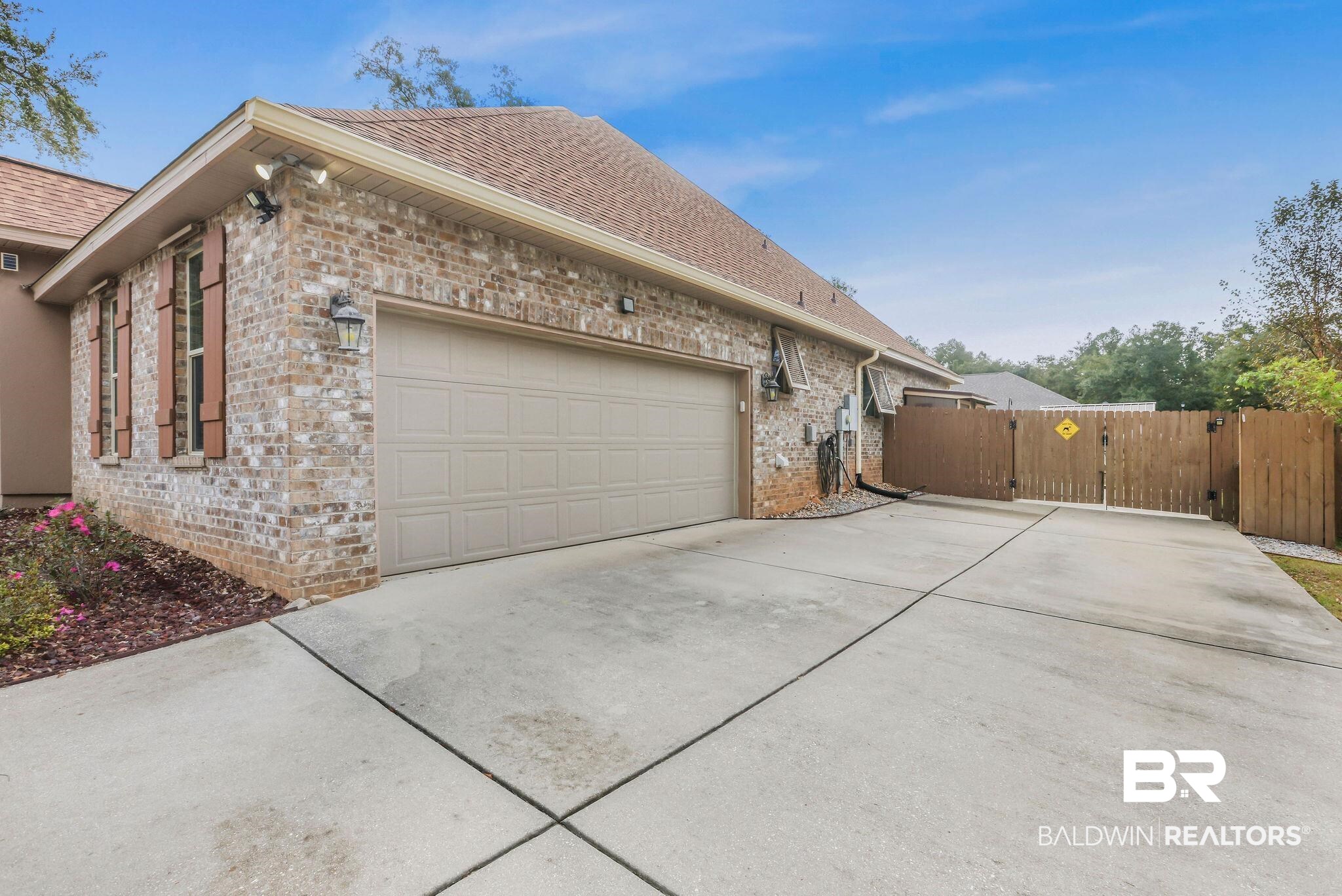 1086 Destin Avenue Foley, AL 36535 - Photo 28 of 30 View of side of property with a garage