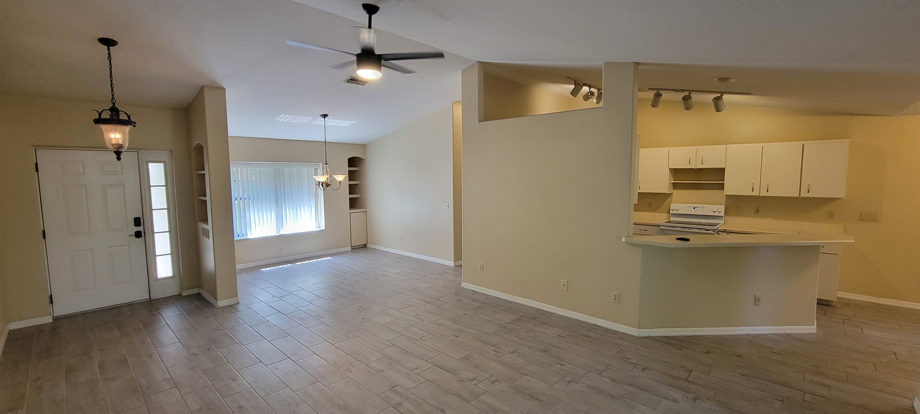 305 Raintree Trail St. Augustine, FL 32086 - Photo 9 of 19 a view of a kitchen with a sink and a mirror
