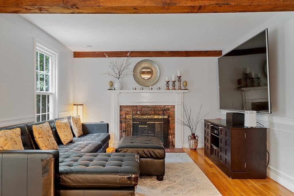 473 Main Street Boxford, MA 01921 - Photo 14 of 42 a living room with furniture and a fireplace