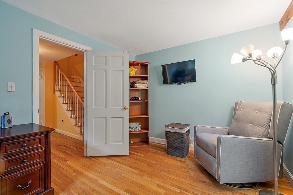 473 Main Street Boxford, MA 01921 - Photo 15 of 42 a living room with furniture and a flat screen tv