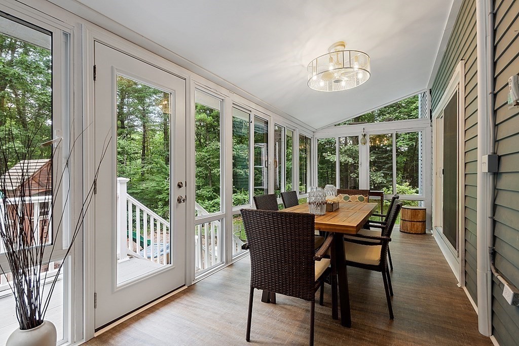 473 Main Street Boxford, MA 01921 - Photo 17 of 42 a dining room with furniture wooden floor and a chandelier