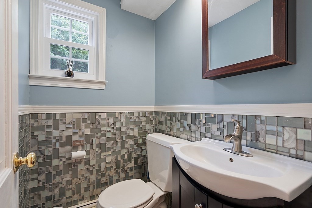 473 Main Street Boxford, MA 01921 - Photo 19 of 42 a bathroom with a sink a toilet and mirror
