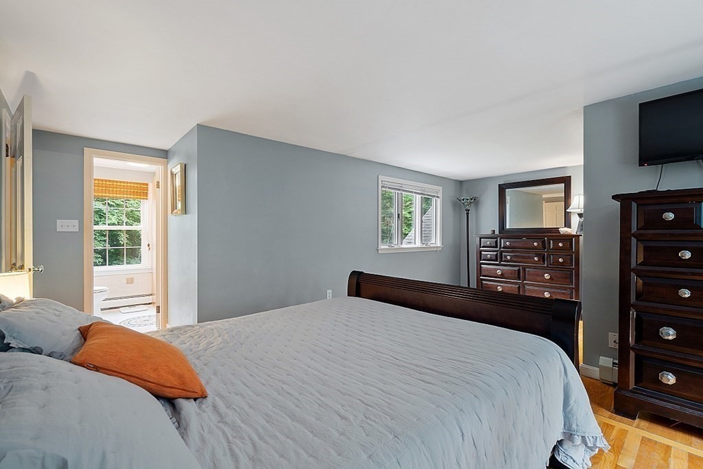 473 Main Street Boxford, MA 01921 - Photo 20 of 42 a bedroom with a large bed and a tv