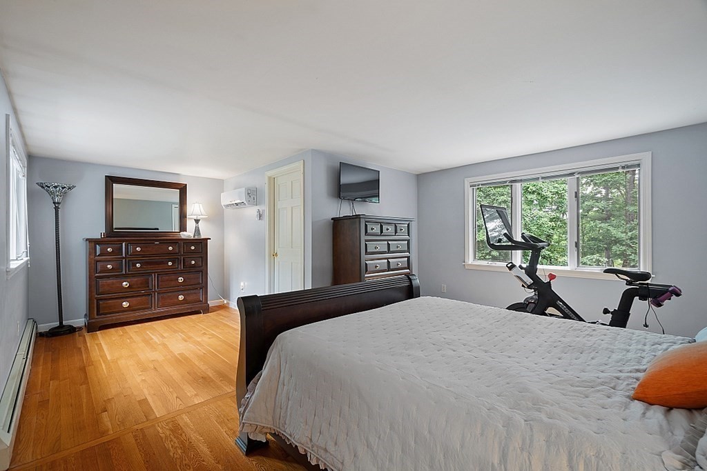 473 Main Street Boxford, MA 01921 - Photo 21 of 42 a bedroom with a bed and a tv