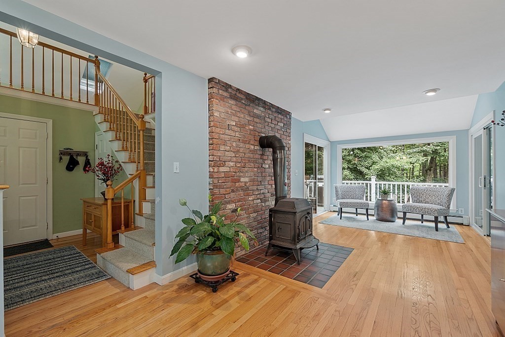 473 Main Street Boxford, MA 01921 - Photo 7 of 42 a living room with furniture floor to ceiling window and wooden floor