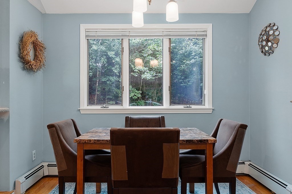 473 Main Street Boxford, MA 01921 - Photo 9 of 42 a view of a dining room with a table and chairs