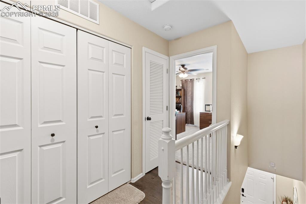 3519 Grey Owl Point Colorado Springs, CO 80916 - Photo 13 of 29 Corridor with dark wood-style flooring