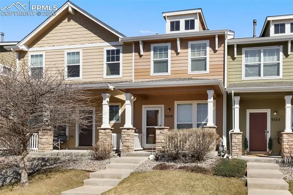 a front view of a house with yard