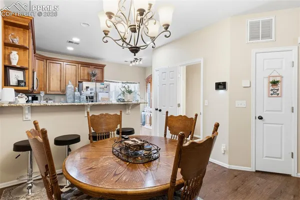 a dining room with furniture and window