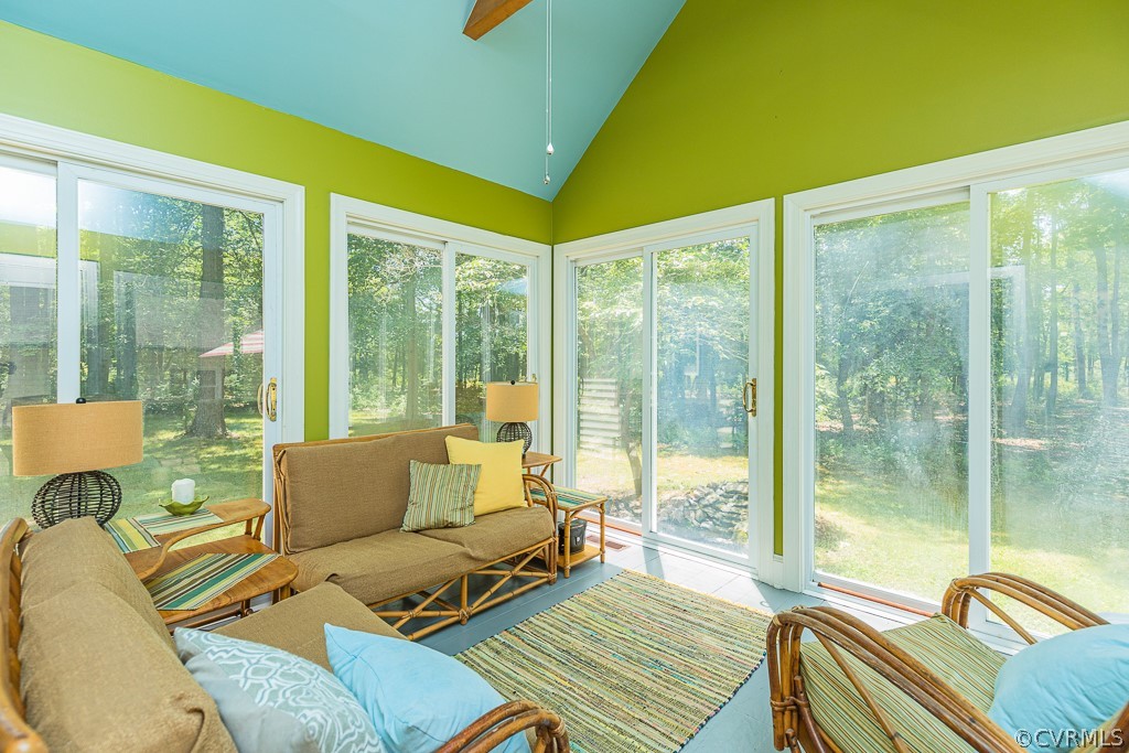 3433 Hales Point Road Farnham, VA 22460 - Photo 13 of 32 a living room with furniture and a floor to ceiling window