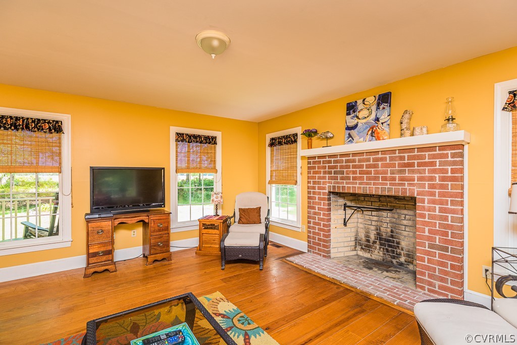 3433 Hales Point Road Farnham, VA 22460 - Photo 20 of 32 a living room with furniture flat screen tv and a fireplace