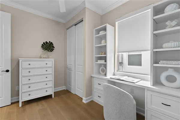 a room with a dresser and a window