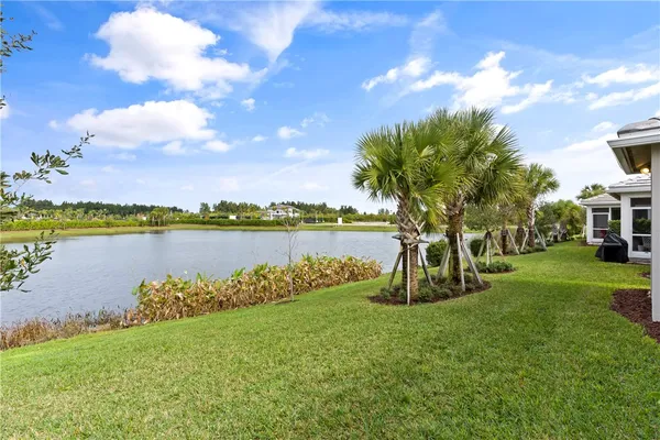 a view of a lake with a big yard