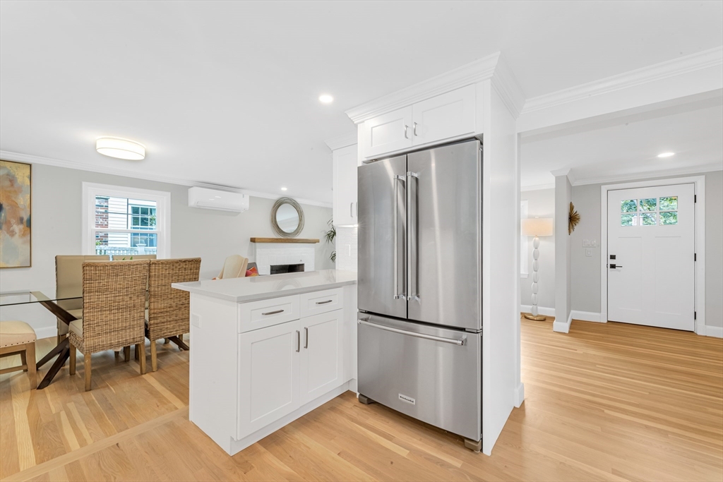 26 Crehore Road Boston, MA 02467 - Photo 12 of 33 a kitchen with stainless steel appliances a refrigerator sink and cabinets