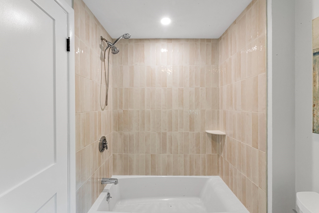 26 Crehore Road Boston, MA 02467 - Photo 20 of 33 a bathroom with a shower and a tub