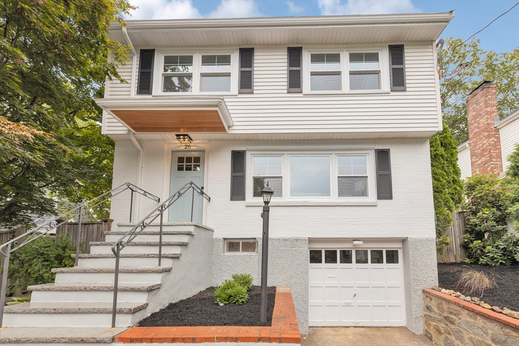 26 Crehore Road Boston, MA 02467 - Photo 2 of 33 a front view of a house with a yard