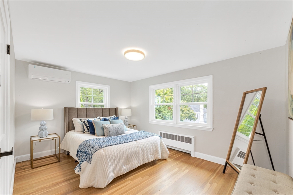 26 Crehore Road Boston, MA 02467 - Photo 24 of 33 a bedroom with a bed and a window