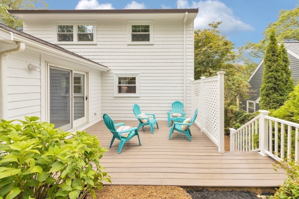 26 Crehore Road Boston, MA 02467 - Photo 26 of 33 a view of a deck with table and chairs and potted plants
