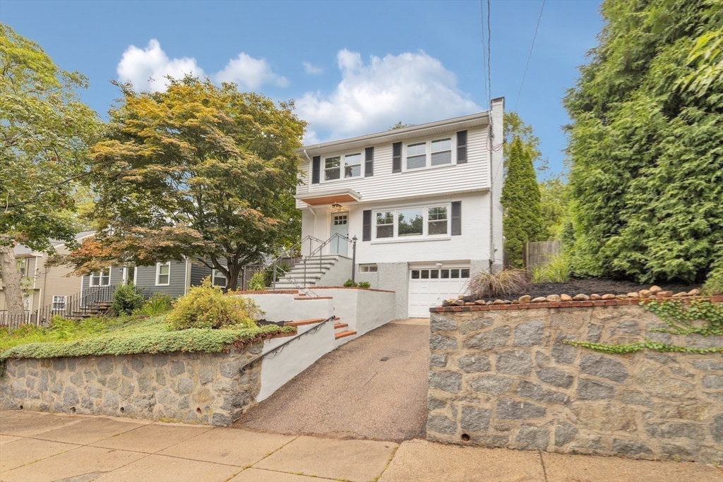 26 Crehore Road Boston, MA 02467 - Photo 30 of 33 a front view of a house with a yard