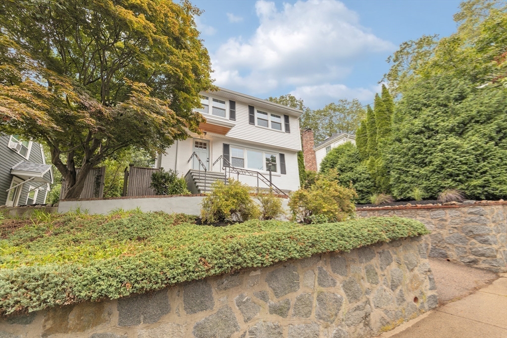 26 Crehore Road Boston, MA 02467 - Photo 31 of 33 a view of a house with a yard